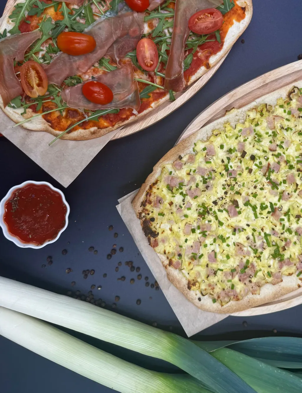 Two flatbreads on baking paper
