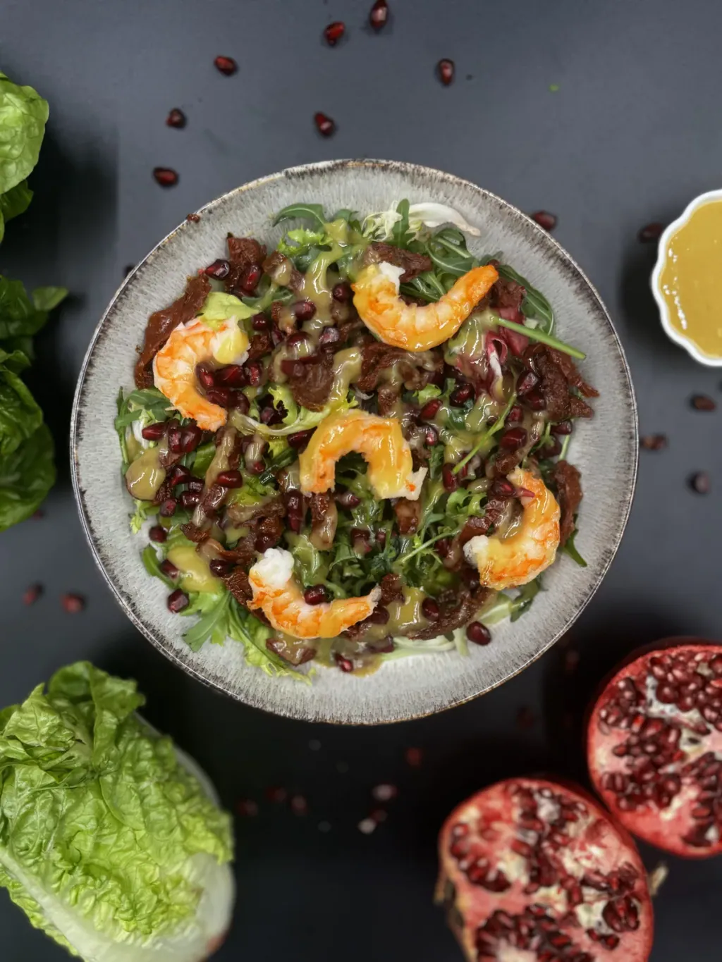 Salad with prawns, pomegranate and sun-dried tomatoes